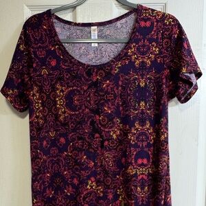 LuLaRoe Classic Tee shirt. High low hem.
Small. GUC. Purple, red, yellow print.